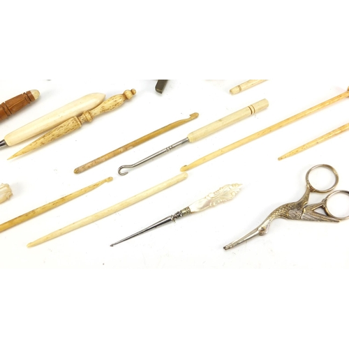 40 - Antique and later objects including ivory whistle, silver thimble, treen needle cases, brass tape me... 