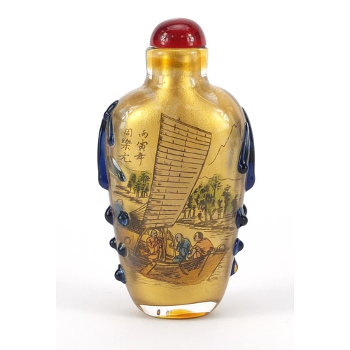 1531 - Chinese reverse glass painted snuff bottle and a pendant, the largest 8cm high