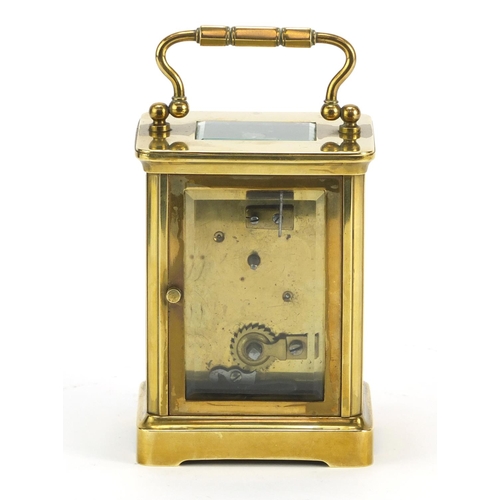 344 - Brass cased carriage clock by Sly & Co of Barnstaple, with key and leather travelling case, inscribe... 