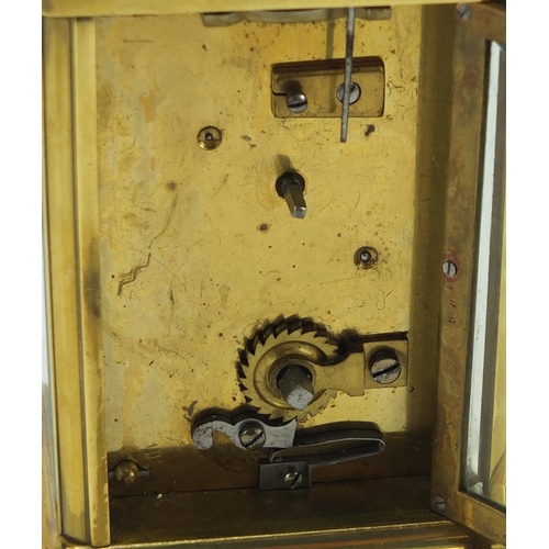 344 - Brass cased carriage clock by Sly & Co of Barnstaple, with key and leather travelling case, inscribe... 