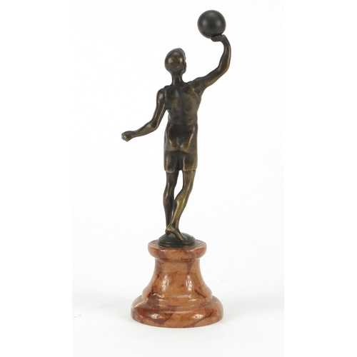 194 - Patinated bronze figure of an Art Deco athlete raised on a circular marble base, 20cm high