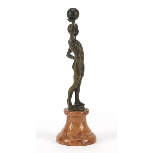 194 - Patinated bronze figure of an Art Deco athlete raised on a circular marble base, 20cm high