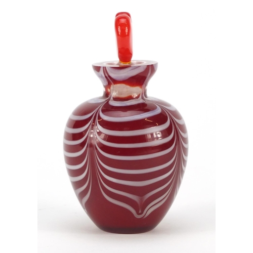 383 - Red cased Art Glass scent bottle with heart design stopper and combed design, 12cm high