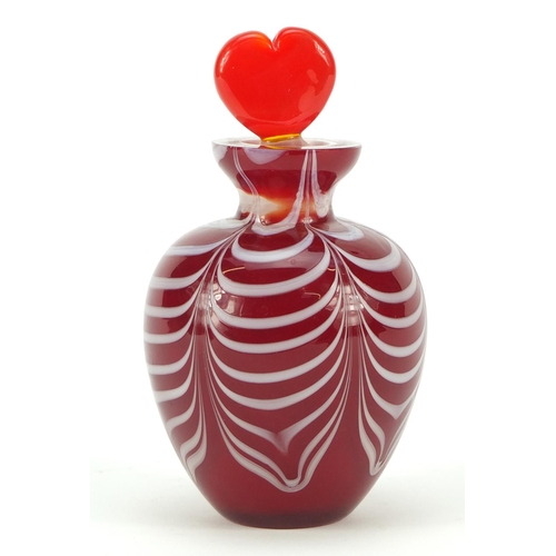 383 - Red cased Art Glass scent bottle with heart design stopper and combed design, 12cm high