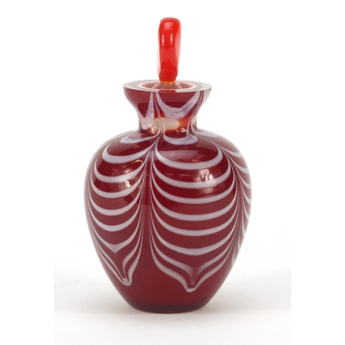 383 - Red cased Art Glass scent bottle with heart design stopper and combed design, 12cm high