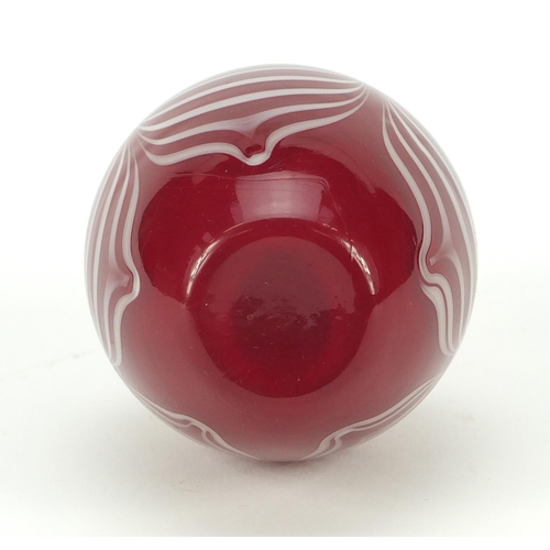 383 - Red cased Art Glass scent bottle with heart design stopper and combed design, 12cm high