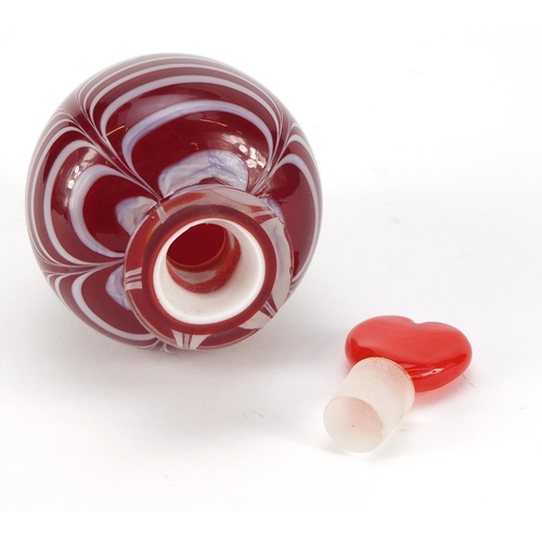 383 - Red cased Art Glass scent bottle with heart design stopper and combed design, 12cm high