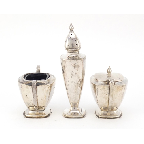 325 - Art Deco silver three piece cruet with matched spoon, O & B Ltd, Birmingham 1937, the caster 12cm hi... 