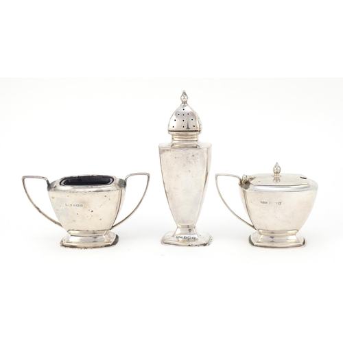 325 - Art Deco silver three piece cruet with matched spoon, O & B Ltd, Birmingham 1937, the caster 12cm hi... 