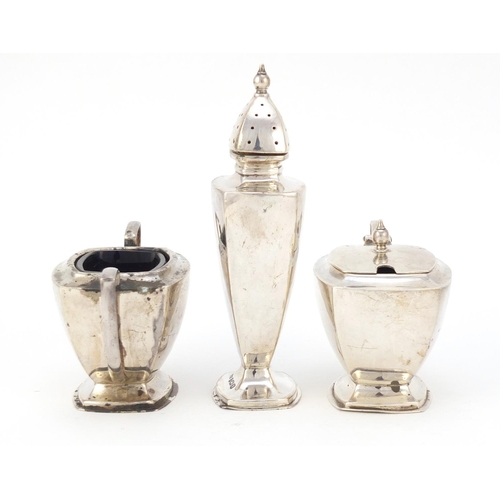 325 - Art Deco silver three piece cruet with matched spoon, O & B Ltd, Birmingham 1937, the caster 12cm hi... 