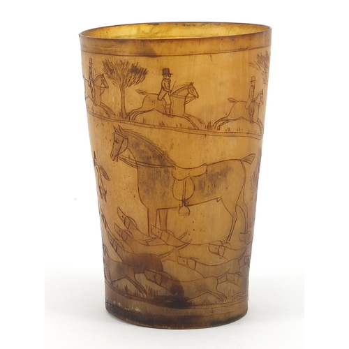 117 - 18th century horn beaker carved with a continuous hunting scene, 11cm high