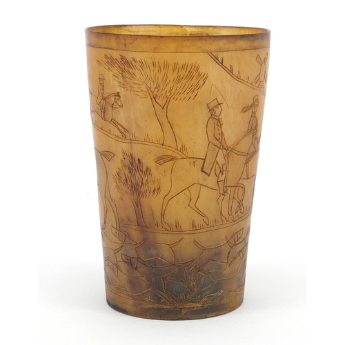 117 - 18th century horn beaker carved with a continuous hunting scene, 11cm high