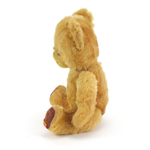 1140 - Antique golden teddy bear with bells and jointed limbs, 39cm high
