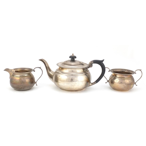 272 - George V silver three piece tea set by Mappin & Webb, Sheffield 1927, the teapot 12cm high x 25cm wi... 