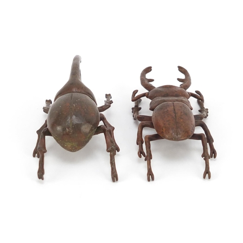 377 - Japanese patinated bronze Hercules beetle and stag beetle, each with impressed character marks to th... 