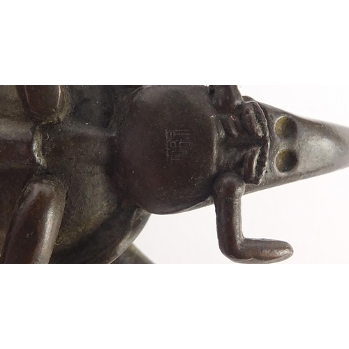 153 - Japanese patinated bronze rhinoceros beetle, impressed character marks to the underside, 10cm in len... 