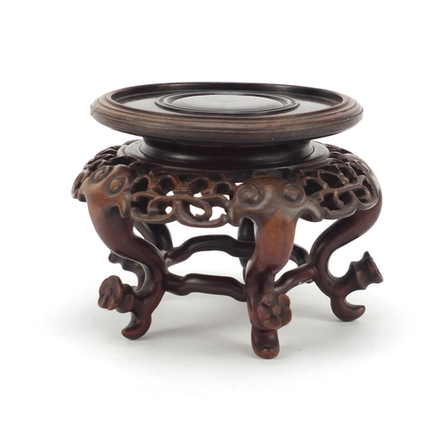 373 - Good Chinese hardwood stand finely carved with flower heads and possibly Zitan, 9cm high x 12.5cm in... 