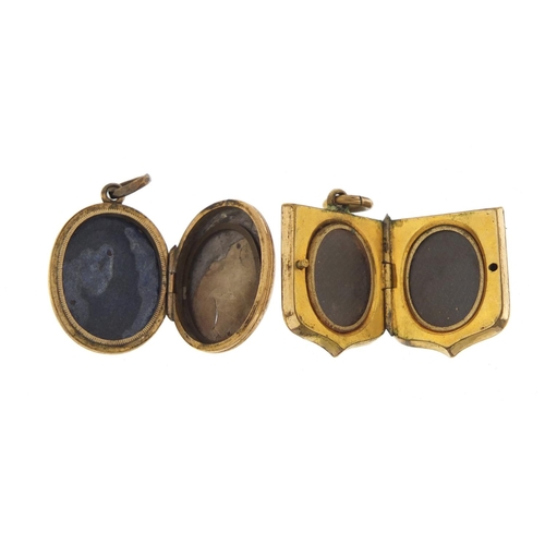 537 - Victorian gold coloured metal and enamel locket and a  shield shaped example, the largest 2cm high