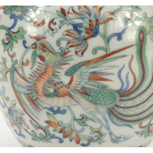 251 - Chinese doucai porcelain vase finely hand painted with a dragon and phoenix amongst flowers, six fig... 