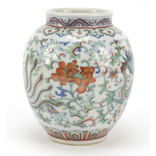 251 - Chinese doucai porcelain vase finely hand painted with a dragon and phoenix amongst flowers, six fig... 