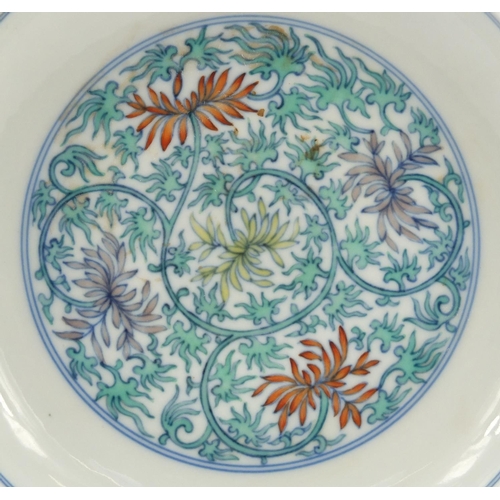 515 - Chinese doucai porcelain dish, hand painted with flowers amongst scrolling foliage, six figure chara... 