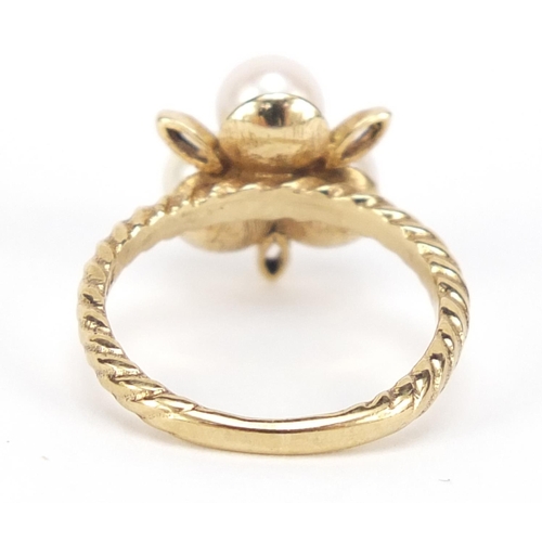 486 - 9ct gold pearl and purple stone ring, size L, 3.4g