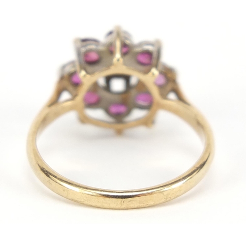 241 - 9ct gold ruby and diamond flower head ring, size K, 2.2g