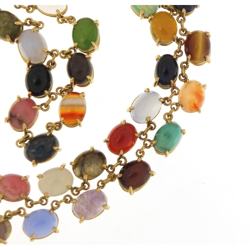 76 - Good 18ct gold necklace set with symmetrical cabochon semi precious stones, including opal, lapis la... 