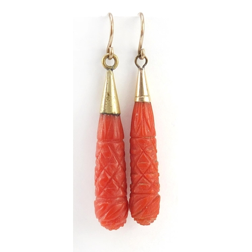 107 - Pair of Victorian carved coral drop earrings with gold coloured metal mounts, 4.2cm in length, 3.6g