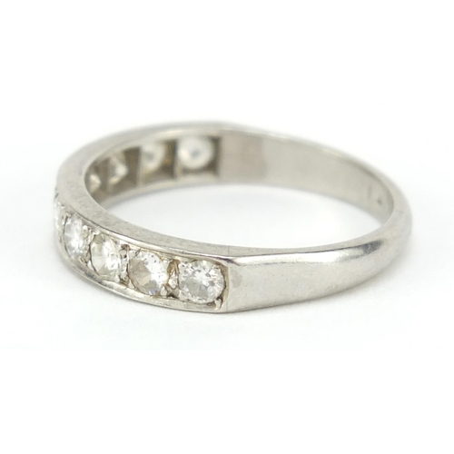 111 - Unmarked white gold and platinum diamond half eternity ring, size P, 4.2g