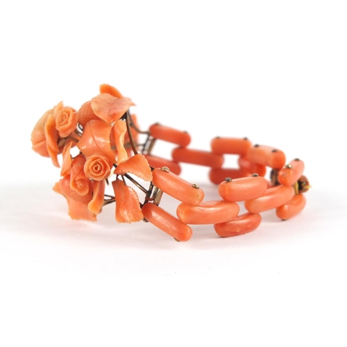 180 - Victorian carved pink coral floral bracelet, 17cm in length, 31.5g