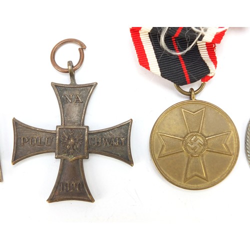 427 - German and Polish militaria including a Cross of Valor, Wounds badge, Iron Cross and 1939 War Merit