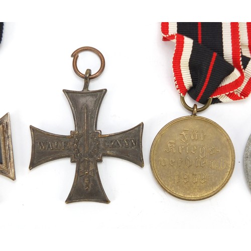 427 - German and Polish militaria including a Cross of Valor, Wounds badge, Iron Cross and 1939 War Merit