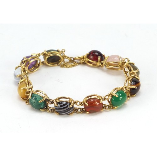 77 - Good 18ct gold bracelet set with symmetrical cabochon semi precious stones including quartz, malachi... 