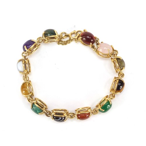 77 - Good 18ct gold bracelet set with symmetrical cabochon semi precious stones including quartz, malachi... 