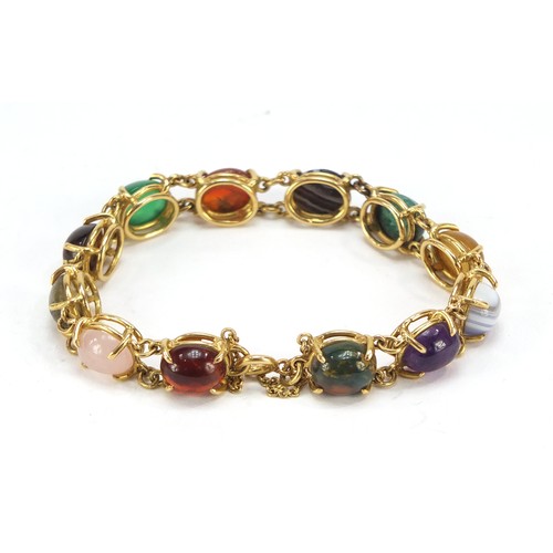 77 - Good 18ct gold bracelet set with symmetrical cabochon semi precious stones including quartz, malachi... 