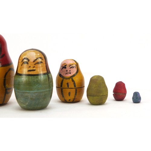 44 - Early Russian Matryoshka hand painted stacking doll comprising twelve inter-fitting dolls, the large... 