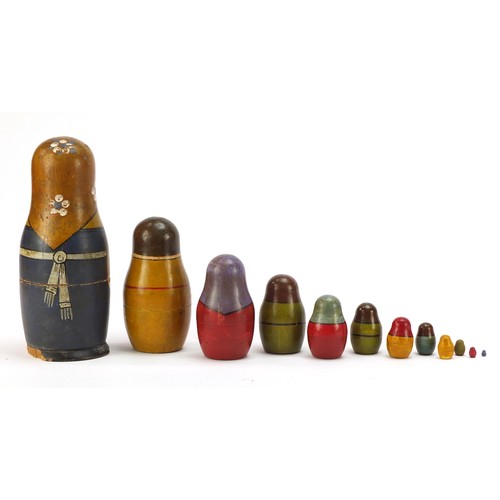 44 - Early Russian Matryoshka hand painted stacking doll comprising twelve inter-fitting dolls, the large... 