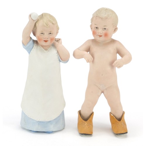 1544 - Pair of 19th century bisque figures of children, the largest 21.5cm high