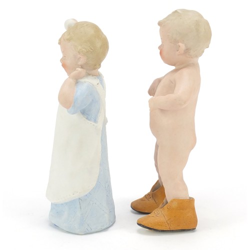 1544 - Pair of 19th century bisque figures of children, the largest 21.5cm high