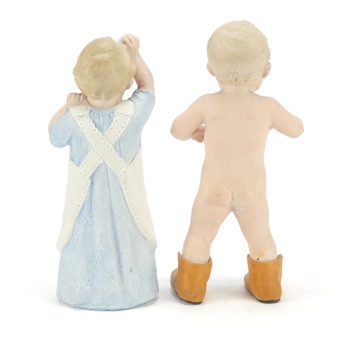 1544 - Pair of 19th century bisque figures of children, the largest 21.5cm high