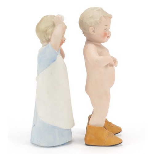 1544 - Pair of 19th century bisque figures of children, the largest 21.5cm high