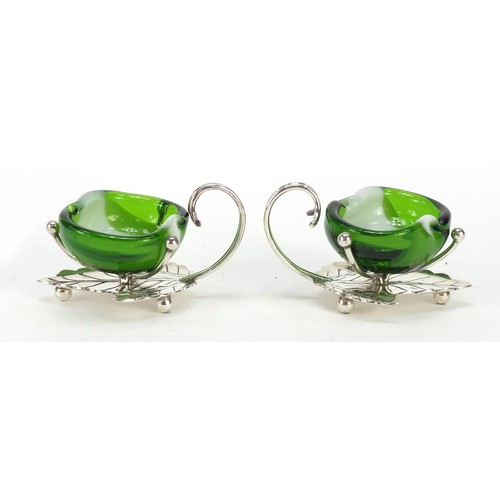 665 - Pair of silver plated naturalistic salts with glass liners, each 7.5cmm wide