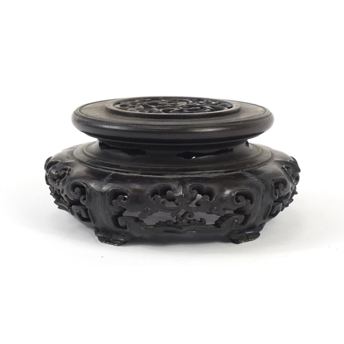 172 - Good Chinese carved hardwood stand carved and pierced with flowers, 12cm in diameter