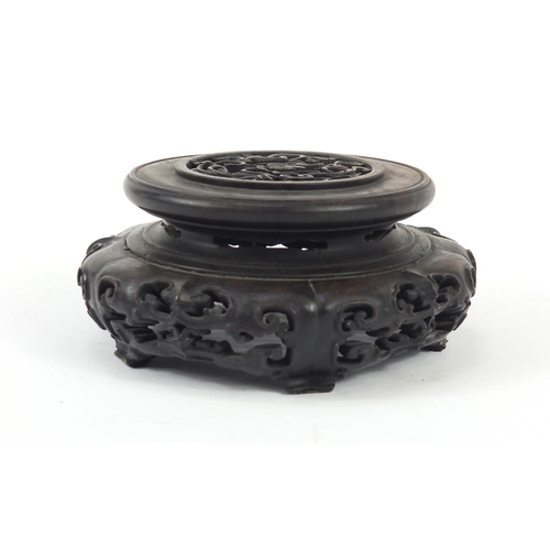 172 - Good Chinese carved hardwood stand carved and pierced with flowers, 12cm in diameter