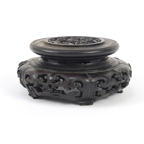 172 - Good Chinese carved hardwood stand carved and pierced with flowers, 12cm in diameter