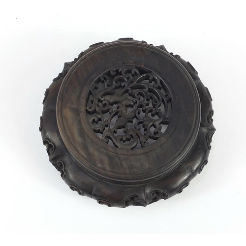 172 - Good Chinese carved hardwood stand carved and pierced with flowers, 12cm in diameter