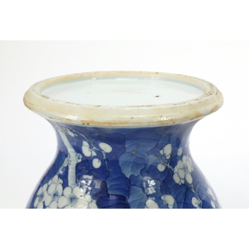 165 - Pair of Chinese blue and white porcelain baluster vases with covers, each hand painted with prunus f... 