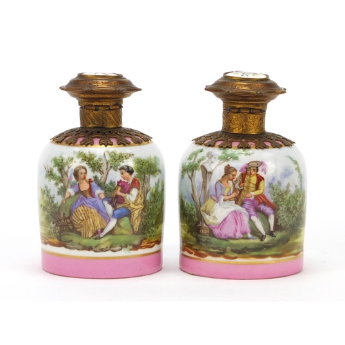 63 - 19th century French porcelain scent bottles with gilt metal mounts and stoppers, each decorated with... 