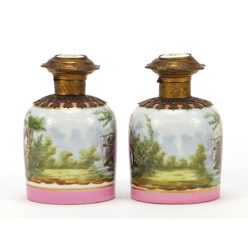 63 - 19th century French porcelain scent bottles with gilt metal mounts and stoppers, each decorated with... 